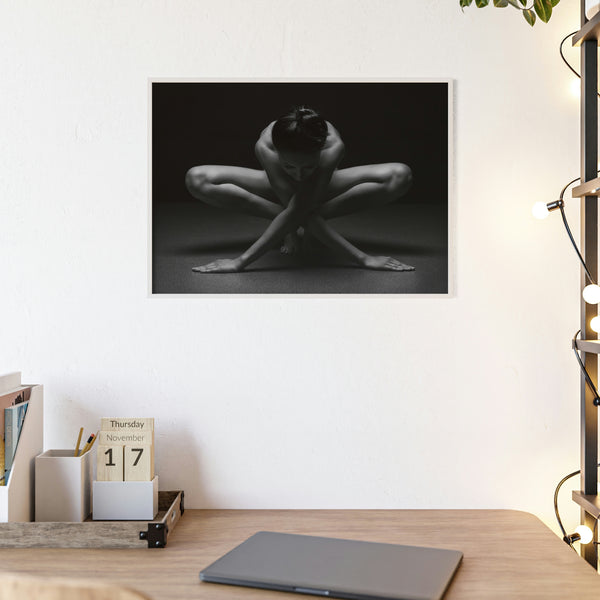A woman in a yoga pose against a dark grey and black background with wooden frame 3