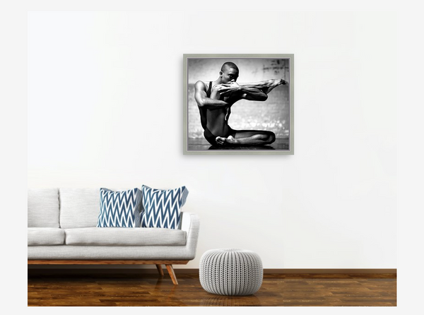 Example of a framed photo fine art print on a room showing an attractive male dance in a black and white photography